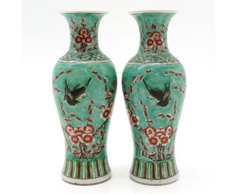Light green background with polychrome decor of flowers and birds, 29 cm. tall, including chip and hairline.