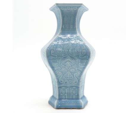 Light blue background with raised decor, incised seal mark on bottom, 36 cm. tall, hairline in glaze, small fritting on edge.