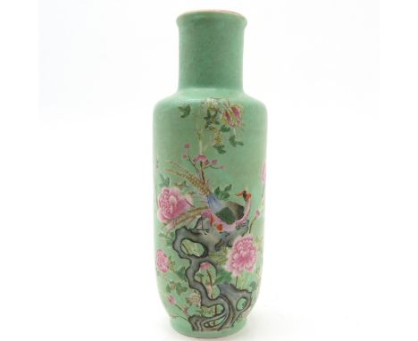 Polychrome decor of pheasants and flowers on light green background, marked with seal mark on the bottom, 34 cm. tall.