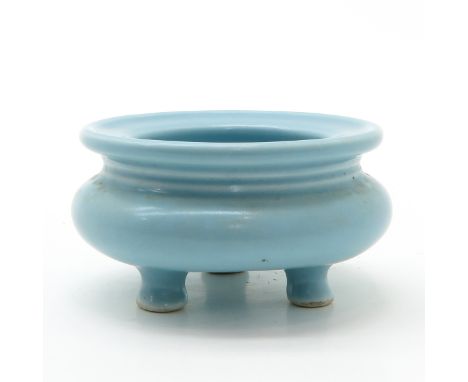Light blue, marked with seal mark on the bottom, 8 cm. in diameter.