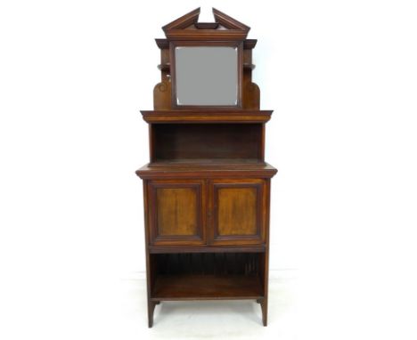 An Edwardian mahogany cupboard with mahogany dentist's cabinet above, the cabinet with single mirrored door, architectural pe