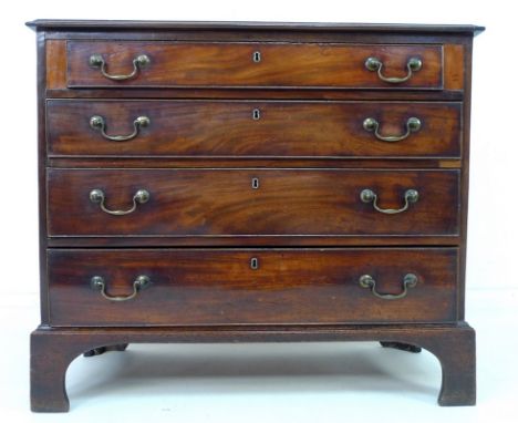 A George III mahogany chest of four graduating drawers, with brass swan neck handles and cock beading, previously sawn in hal