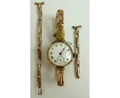 A lady's 9ct gold wristwatch, the white enamel dial with Roman numerals and subsidiary seconds dial, the movement marked Nirv