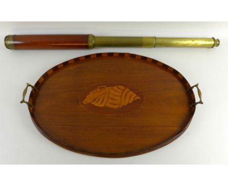 A Victorian marquetry tray, the oval body inlaid with shell to centre, brass handles, 60 by 39cm, together with a Victorian t