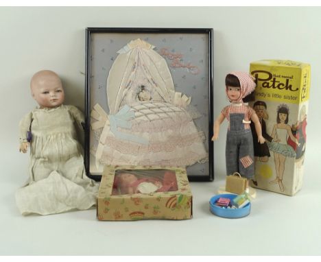 A group of dolls, comprising a Schoenau and Hoffmeister German bisque headed doll, circa 1930, with squeaking action on being