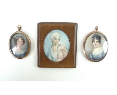 A pair of portrait miniatures of young ladies in blue dresses, one signed J. Bailey,1829, watercolour on ivory, backed with w