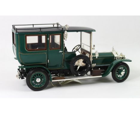 A group of three Franklin Mint 1:24 scale models comprising a 1955 Bentley S, a Rolls Royce Silver Ghost and a BMWZ8, all box