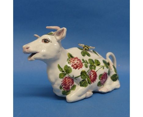 A Wemyss Ware "Bovey Tracey" Pottery Cow Creamer, painted in polychrome with flowers, script mark in brown "Ex333, B. Adams, 