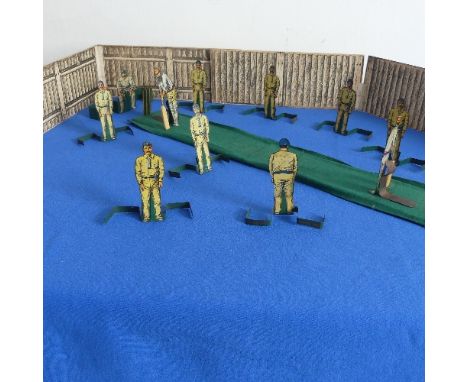 A Lamplough's Model Cricket game, comprising eleven tinplate cricketers including two batsmen, wicket keeper and eight fielde