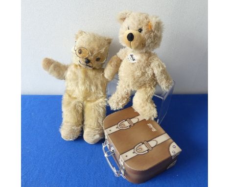 A Steiff Charly bear in Suitcase box, H 24cm approx, serial number 012938, together with a vintage plush bear (2) 