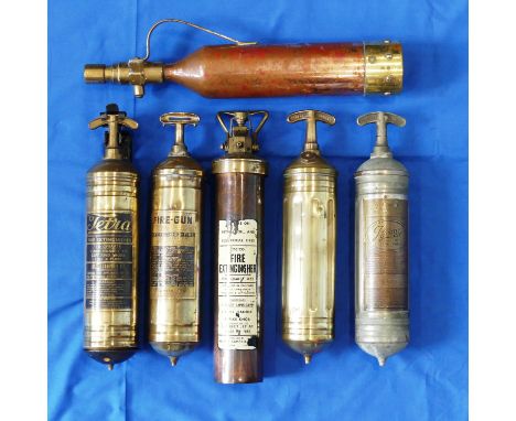 Six vintage Fire Extinguishers, mostly brass, including examples by "Tetra" with wall bracket, Nu-Swift Ltd, Pyrene, and Foam