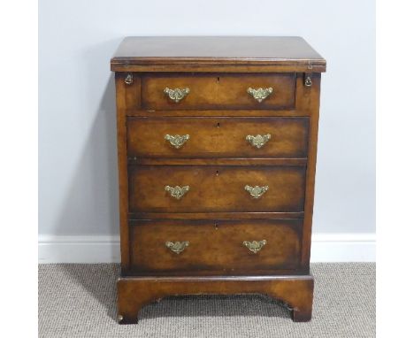 A George III-style walnut Bachelor?s Chest of Drawers, with cross-banded fold over top, above four long graduated drawers wit