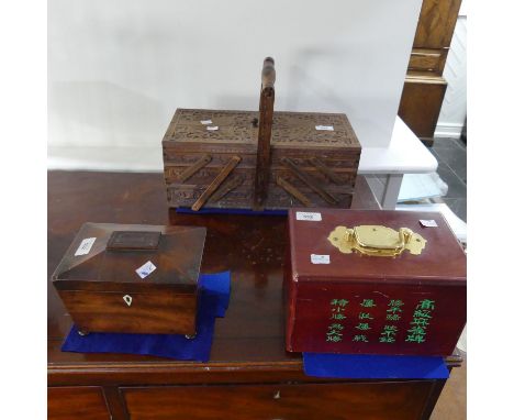 A 20thC cantilever Sewing Box, with carved decoration and contents, 41cm wide, together with a wood and brass cased Mahjong s