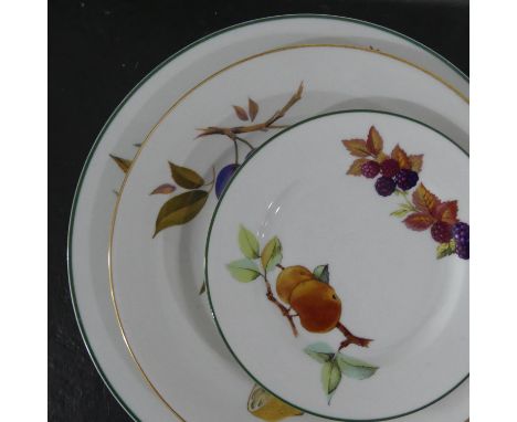 A Royal Worcester Evesham and Evesham Vale part Dinner and Tea Service, comprising cups and saucers, tureens, plates, mugs, b
