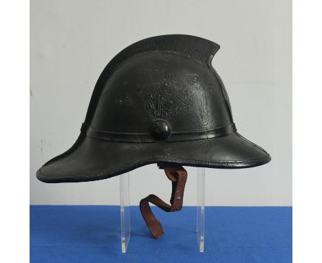 A Victorian leather Fire Helmet, black, ?CFS? badge, with inner liner, 23cm high. 