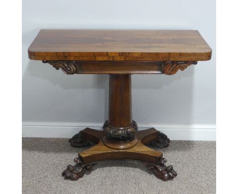 A William IV rosewood Card Table, the swivel and fold-over top revealing circular green baize inset, raised upon heavily moul