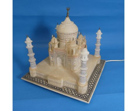 Alabaster lamp in the form of the Taj Mahal, raised on square base with geometric border pattering, circa early 20th century,