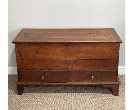 A late 18thC oak Mule Chest, with hinged lid opening to reveal a large compartment, the front with two drawers, raised on bra