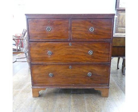 A Georgian Mahogany Chest of Drawers, comprising two short drawers over two long drawers with metal ring handles, on bracket 