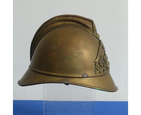 A 19th century French brass Fire Brigade Helmet, circa 1860, with Sapeurs Pompiers Roisel badge and side plume socket, lacks 