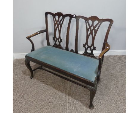 A 19thC mahogany Chippendale style two seat Sofa,&nbsp;with pierced back splats, fitted cushion, raised on carved cabriole le