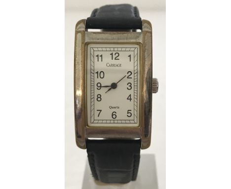 A vintage Timex oblong cased quartz watch by "Carriage". With brown leather strap. 