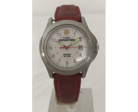 A 12/24hr dial Timex Expedition Indiglo wristwatch. Water resistant to 50m. With original red water resistant leather strap. 