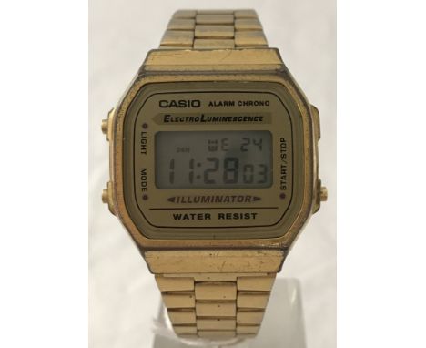 A vintage Casio gold tone digital wrist watch in working order. A168-WG9-1572, Japanese mvmt, mineral glass. Day, date, alarm
