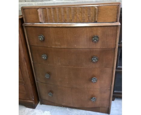 A vintage bow fronted 5 drawer chest of drawers with scalloped top drawer.  Approx. 76cm wide x 106cm tall.