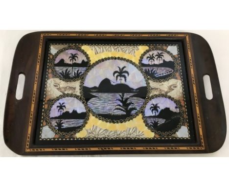 A vintage wooden framed souvenir tray from Rio de Janeiro, Brazil set with butterfly wings. With inlaid detail. One handle a/