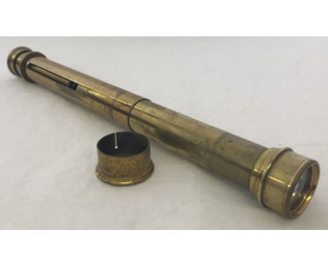 A vintage brass telescope/optical instrument.  