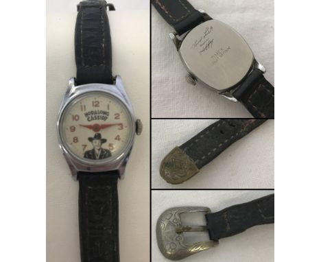 A Hopalong Cassidy original 1950's vintage watch by Timex. With leather strap with belt effect buckle. Engraved to reverse "G