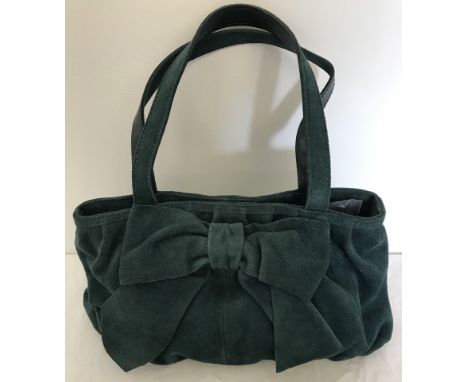 A green suede Kaliko handbag with bow detail. With interior zip and phone compartment. In as new condition. Approx. 33cm x 16