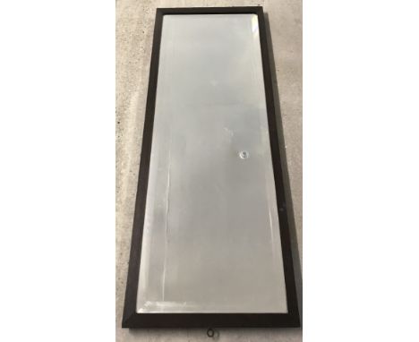 An vintage oak framed wall mounting dressing mirror. With bevelled edge glass. Approx. 125 cm x 47 cm.