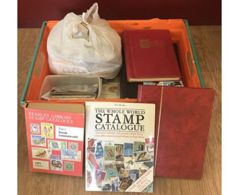 A box of 8 vintage stamp albums, 2 stamp catalogues, first day covers and a bag of loose stamps. To include British and World