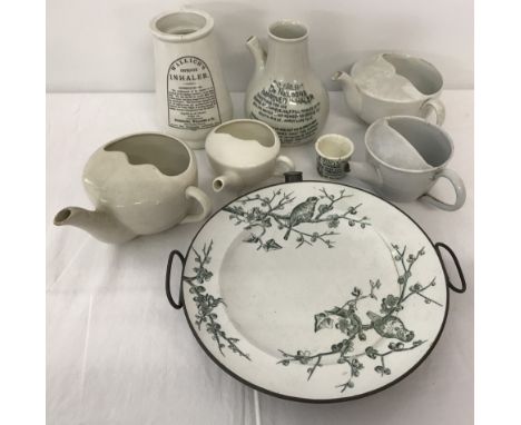 A collection of vintage ceramic feeding cups and ceramic inhalers.  