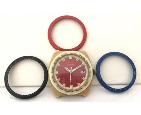 Unusual 1970's Racine watch head with world time bezel together with 3 other interchangeable bezels. Cream coloured shatter p