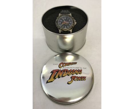 An Indiana Jones Lucas Films / Paramount pictures gents wristwatch. With black leather strap. In original promotion tin case,