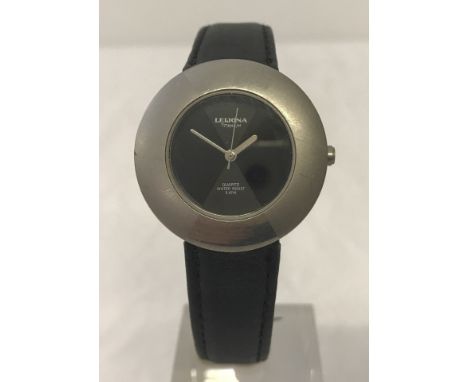 A Leijona titanium cased quartz wristwatch with black dial and black leather strap. Water resistant to 5ATM, 5188-251 