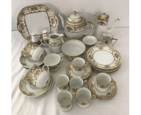 A collection of Noritake tea and coffee ware in white and gold pattern #44318. Comprising sandwich plate, tea pot and stand, 