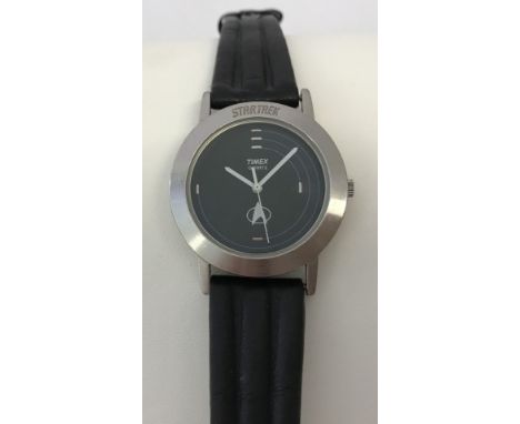 A stainless steel cased Timex "Star Trek" wristwatch with black leather strap. Water resistant. With red case. 