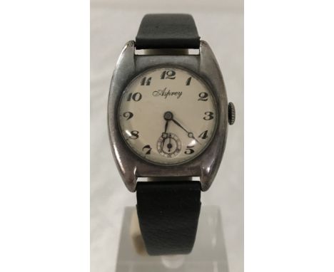 A 1920's silver cased watch with Asprey engine turned dial on a leather strap. 12 hour dial, with subsidiary second hand, blu