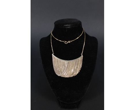 A 9ct gold and silver necklace with 9ct gold chain suspended from main bar which has fine 9ct gold and silver chains hung