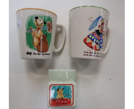 A VINTAGE 'SOOTY' CHIMNEY SWEEP MUG a Sooty egg cup and a Queen of  Hearts mug (3)