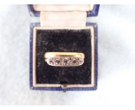 A 22 CT GOLD WEDDING BAND approx 5g and an 18 ct gold five -stone ring, approx 2g (both flattened on one side)