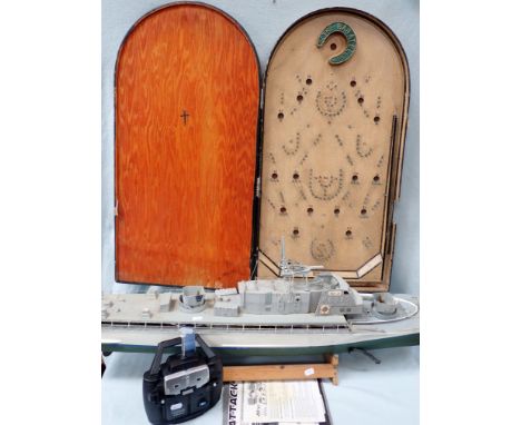 A VINTAGE BAGATELLE BOARD a remote controlled boat, and a Futaba R/C unit (all in need of attention)