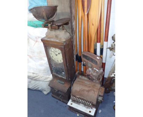 A VINTAGE 'BLICK' TIME RECORDER a Vintage metal till, a set of scales and an old petrol pump gauge (all as found from long te