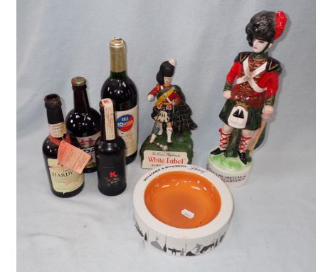 A VINTAGE 'WHITE LABEL' ADVERTISING FIGURE in the form of a Highlander (hand off but present) a ceramic, 'Black Watch' decant