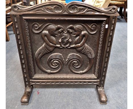 A FRENCH RENAISSANCE STYLE CARVED OAK  GROTESQUE PANEL made into a firescreen 72 cm wide
