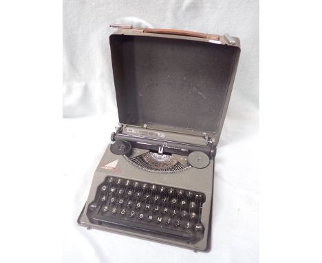 A VINTAGE 'HERMES BABY' TYPEWRITER with metal case